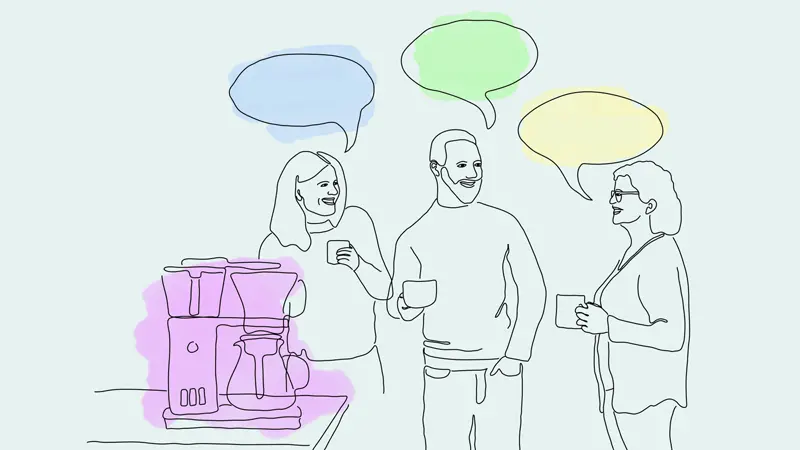 People standing by a coffee machine gossiping.